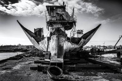 Remains of the wreck of M/V OS35 at the port of Amsterdam. The main engine is still standing with engine room hull construction and plating on the sides. Facing from aft to forward after propeller and shaft were removed,